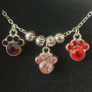Dog Paw Charm Bracelet new in box. Silvertone, 6" - lobster claw closure purple